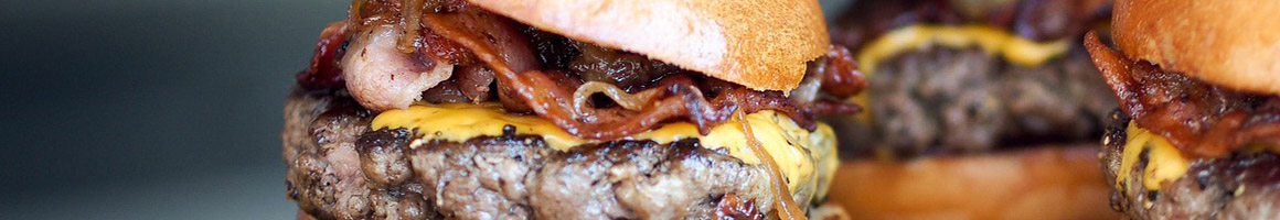 Eating American (Traditional) Burger at Bionic Burger Hamburgers restaurant in Wichita, KS.